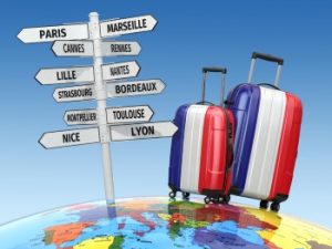 Travel concept. Suitcases and signpost what to visit in France.